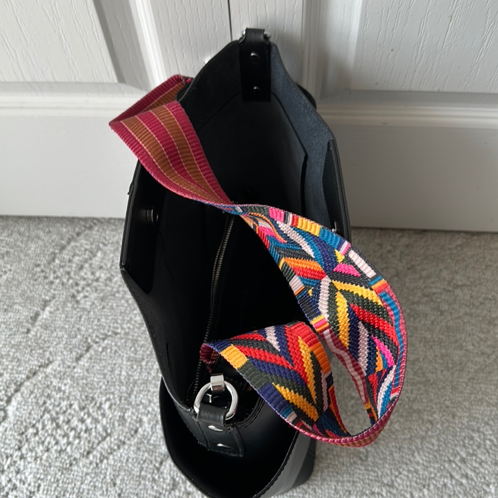 A black,authentic leather,bucket bag with a black makeup bag included.